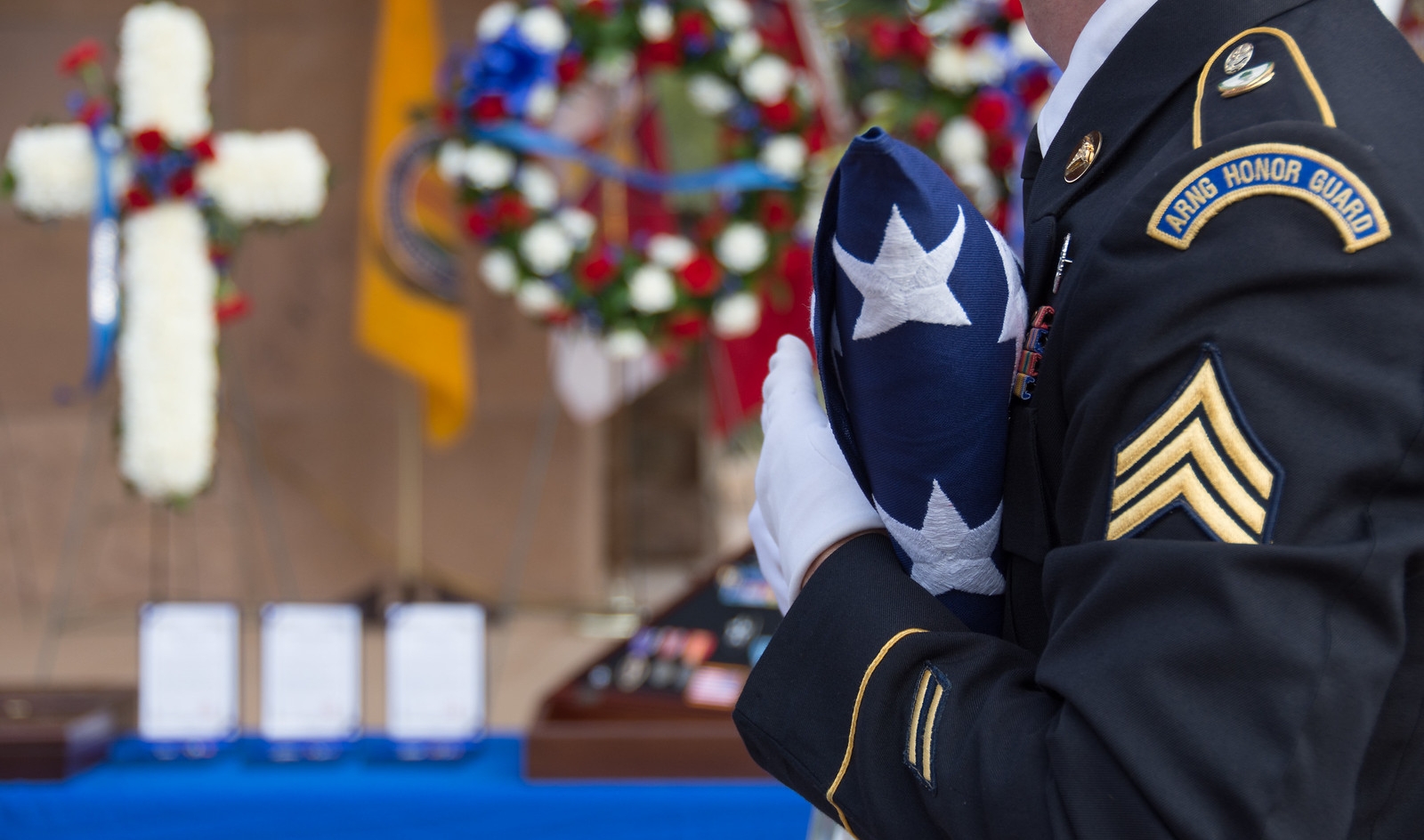 Arizona Military Funeral Honors. At the funeral, a soldier dressed in a fine suit brazing the American flag to his chest. In a ceremonial event surrounding