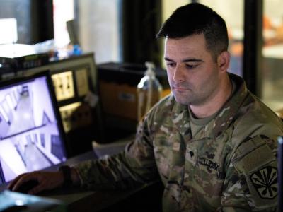 Soldier looking at computer 