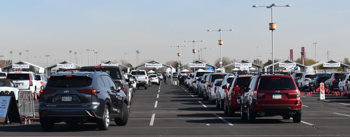 Photo of rows of cars lined up to get vaccinated during the COVID-19 outbreak.
